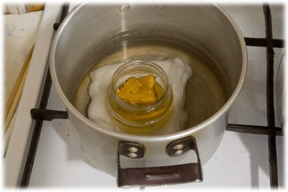 Heat honey in a saucepan 